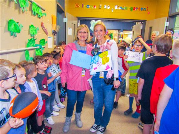 Students and teachers dressing up for a vocabulary parade. 